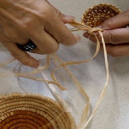 Hands making a piece of art out of string